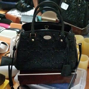 Black and gold Coach purse